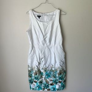 White dress that is fitted and zips in the back